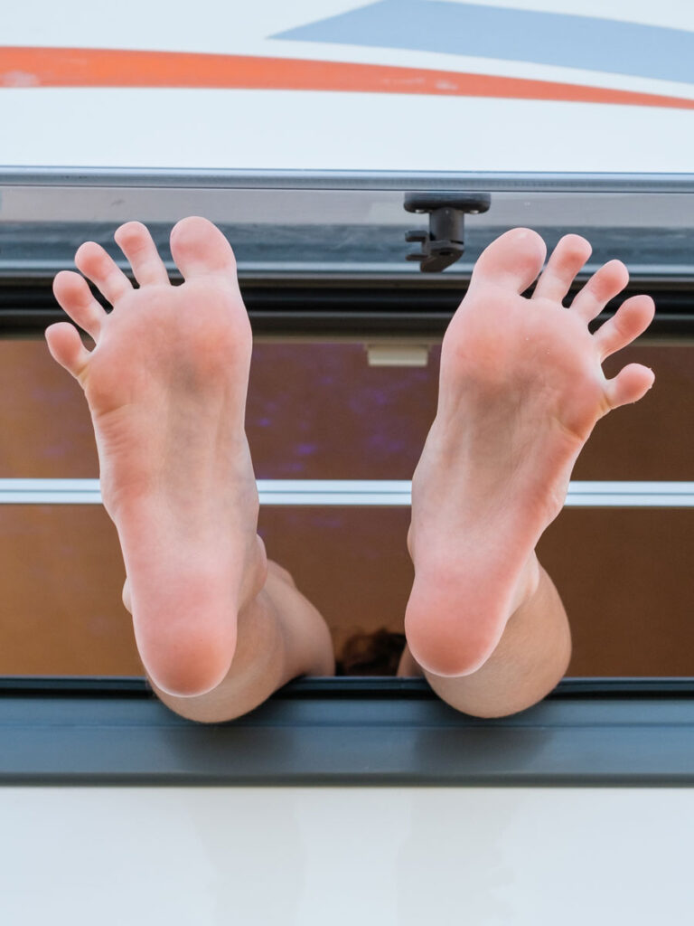 Feet sticking out of motorhome window